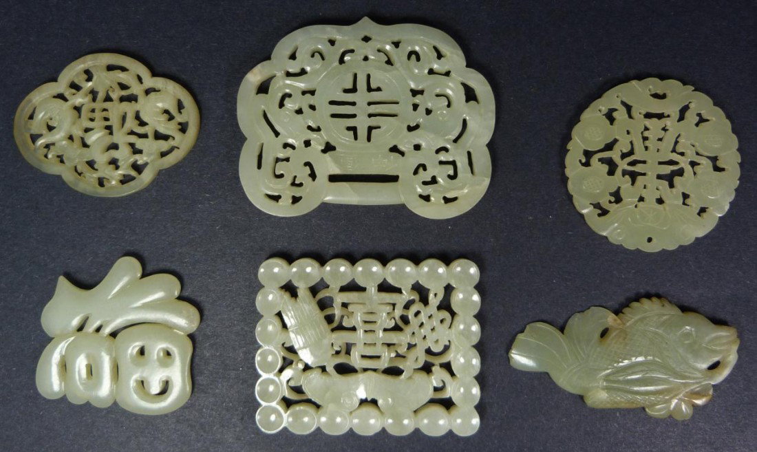 6 CHINESE RETICULATED CARVED JADE PLAQUES: Lot of 6 Chinese hand carved fully reticulated jade plaques. Pieces depict a fish, flowers, bats and calligraphy. Each has great translucence. 19th/20th century. Largest measures 3 1/4" width x 2 5/8"