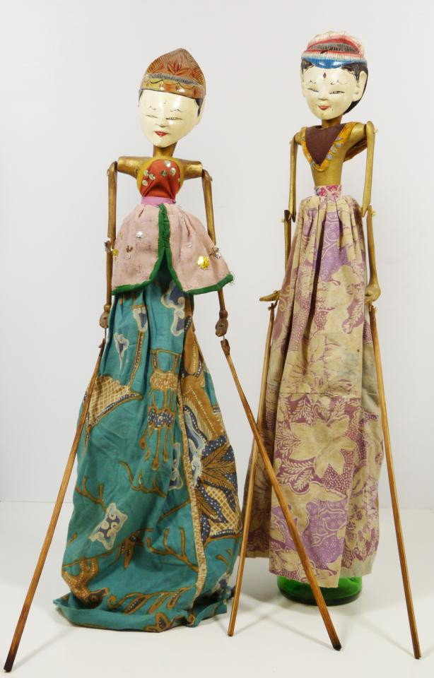 PAIR OF 19th C. CHINESE HANDMADE STICK PUPPETS: Antique figure wooden puppets. The puppets are made to be inserted into a bottle and their dresses fall over the bottle to appear as the lower half of the body. Each measures approximately 22" height 