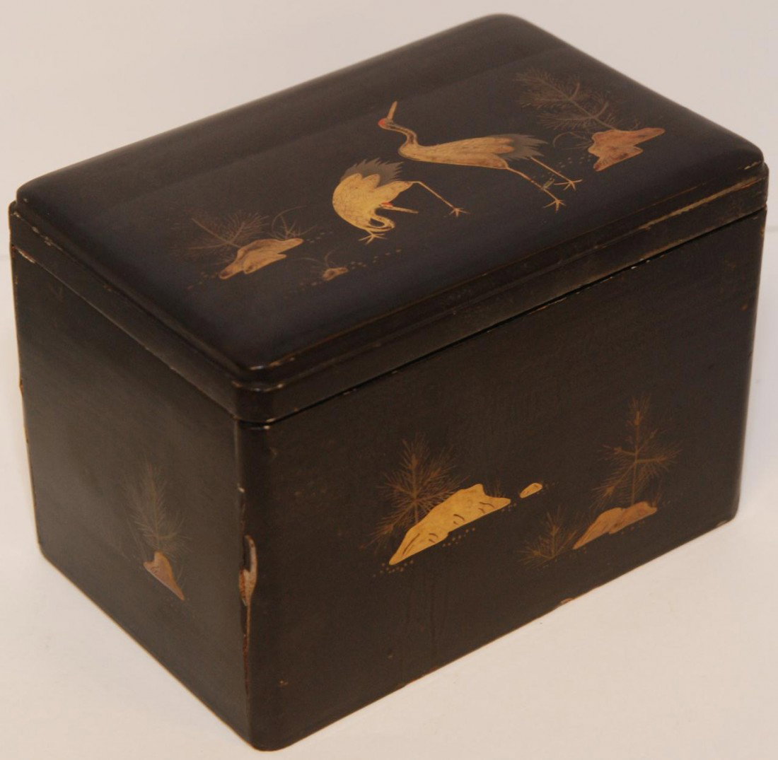 ANTIQUE HAND PAINTED LACQUER HUMIDOR BOX: Antique hand painted black lacquer humidor box with gilded stork design to top. Sides of box has a gilded floral design with rocks. Black lacquer interior to box. Includes metal box insert with etched