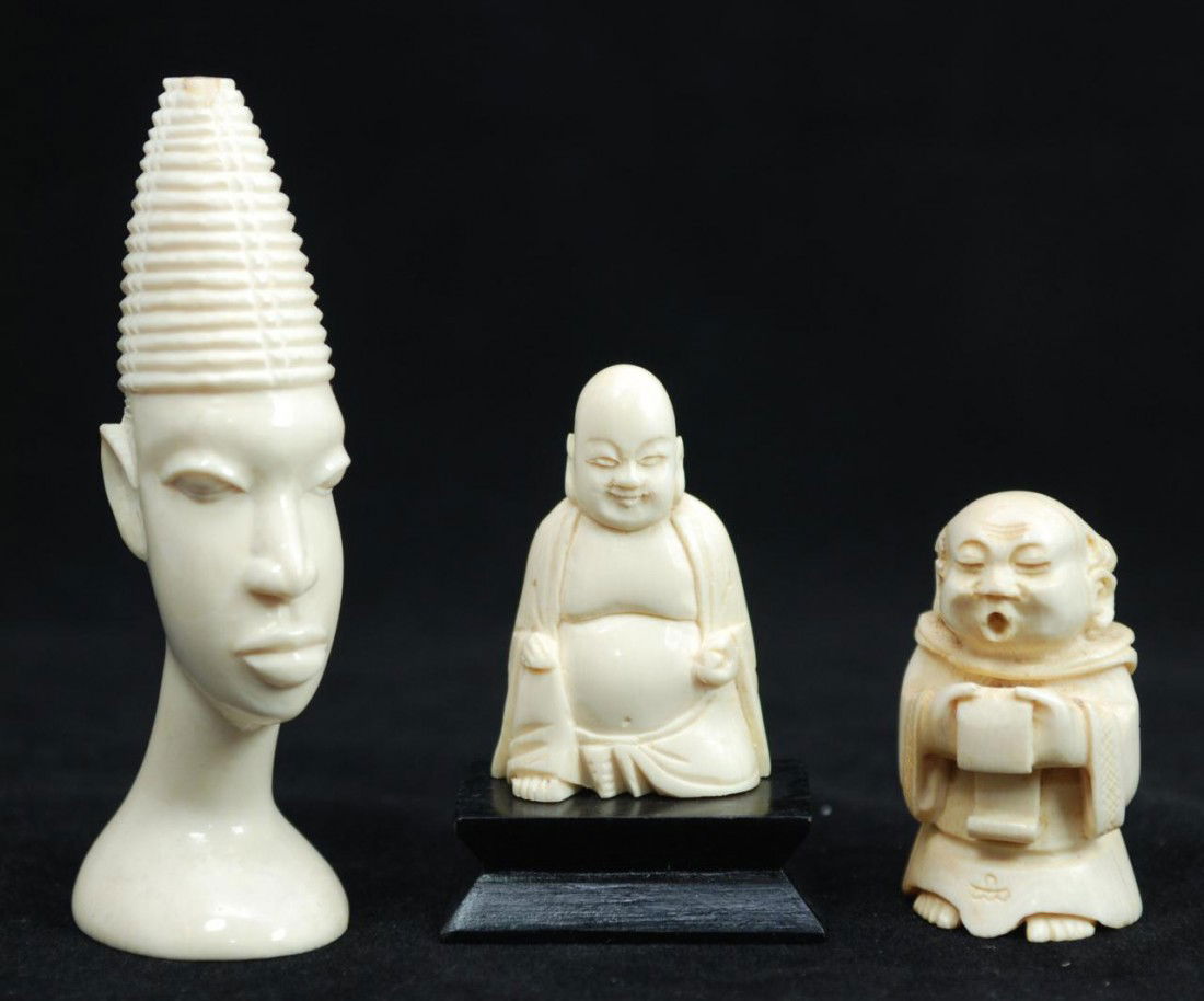 3 PIECE LOT OF CARVED IVORY FIGURES: Lot of 3 hand carved ivory figures. One depicts a Kneeling Buddha (2" height/5.1cm). The next depicts a wise man reading a scroll (2"/5.1c). The third is an African ivory carving of a tribal priest (4
