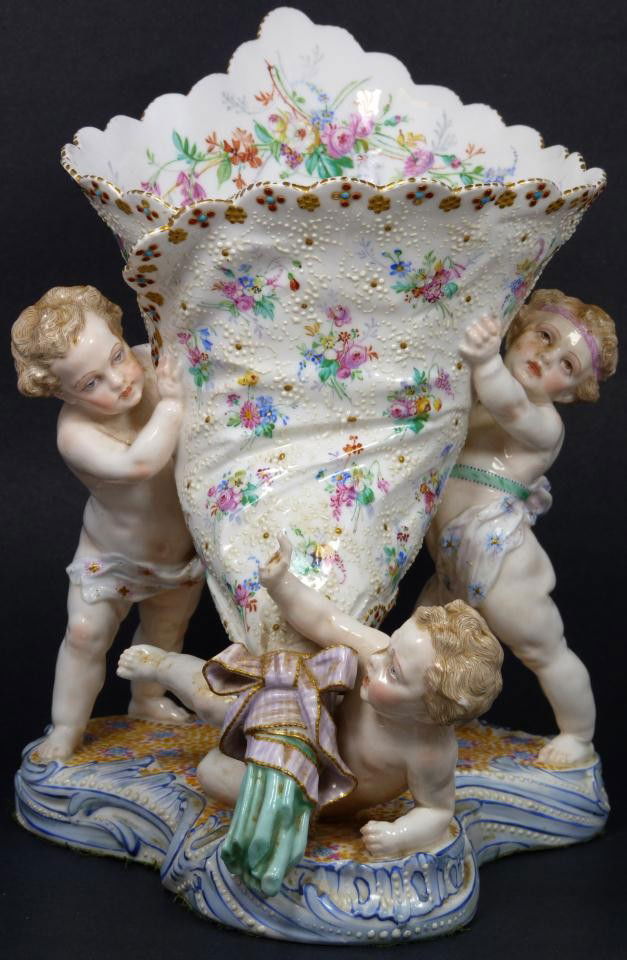 FRENCH PORCELAIN EXPOSITION PARIS CHERUBS VASE: Breathtaking antique 19th century French porcelain vase depicting three cherubs holding up a bouquet wrap. Stunning craftsmanship throughout with vivid hand painted floral and enamel beaded designs. G