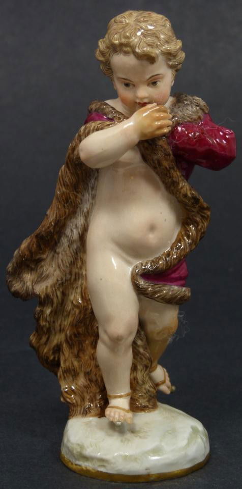MEISSEN PORCELAIN FIGURE WINTER SEASON CHERUB: Antique Meissen German porcelain figure. Depicts a boy wearing a fur lined coat with ice skates. Part of the Four Seasons Collection. Represents the season of Winter. Blue crossed swords mark to botto