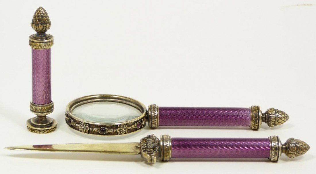 RUSSIAN SILVER & ENAMEL THREE PIECE DESK SET: Russian silver enameled three piece desk set. Set includes a magnifying glass, letter opener and seal. Each has a magnificent purple guilloche enamel design to handle with figural acorn finial to ends