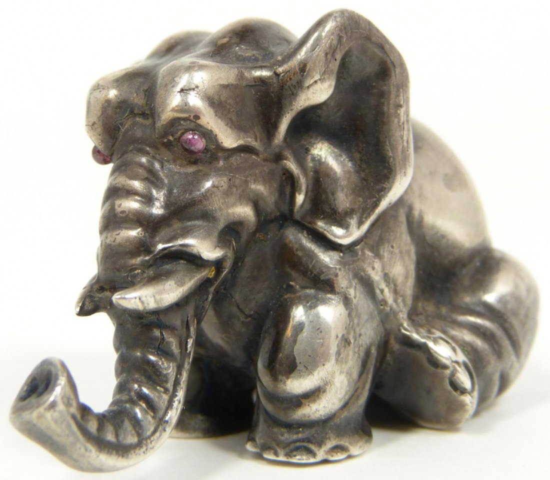 RUSSIAN SILVER SITTING ELEPHANT FIGURINE: Russian sterling silver elephant figure. Has cabochon cut pink stones set to eyes. Finely crafted. Holds Julius Rappaport Cyrillic workmaster marks to bottom. Holds 84 silver purity marks with town ma