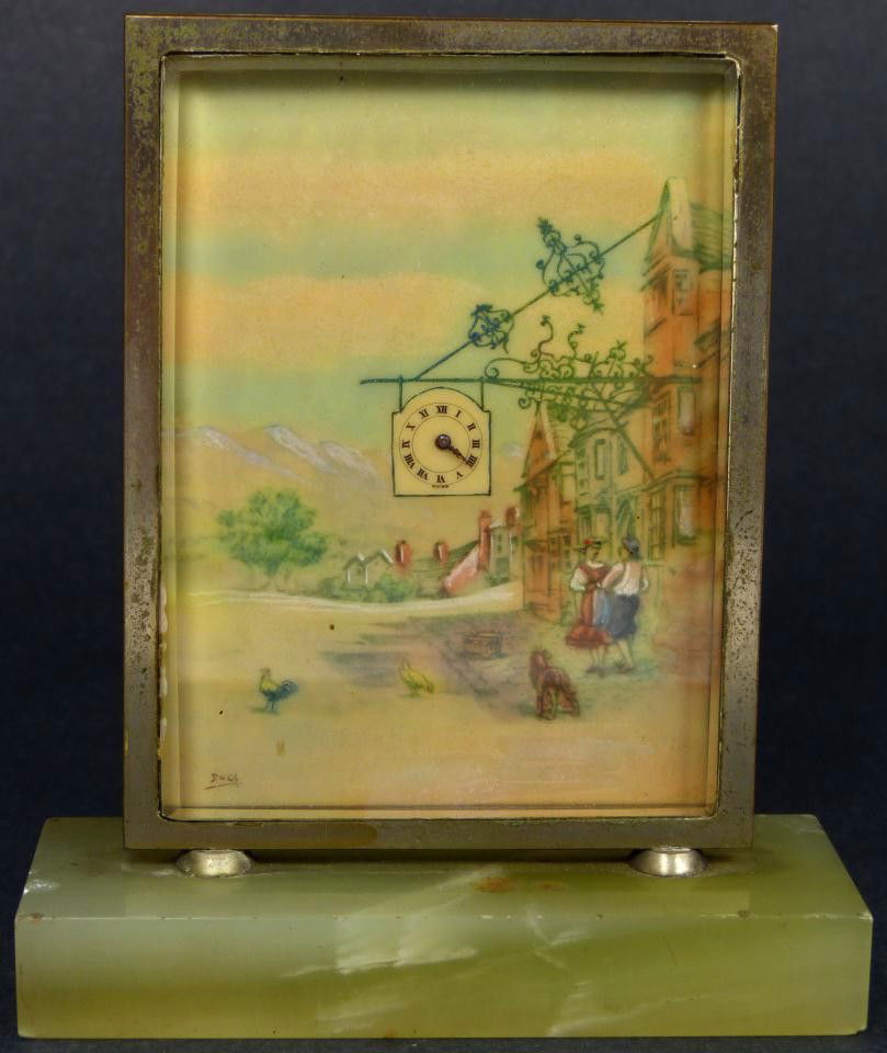 ANTIQUE SWISS MADE HAND PAINTED DESK CLOCK: Antique Swiss made desk clock with hand painted ivory face. Has hand painted street scene with cock sign cleverly used as the face. Signed Duca lower left. Mounted on onyx base. Marked 7 19204 to back