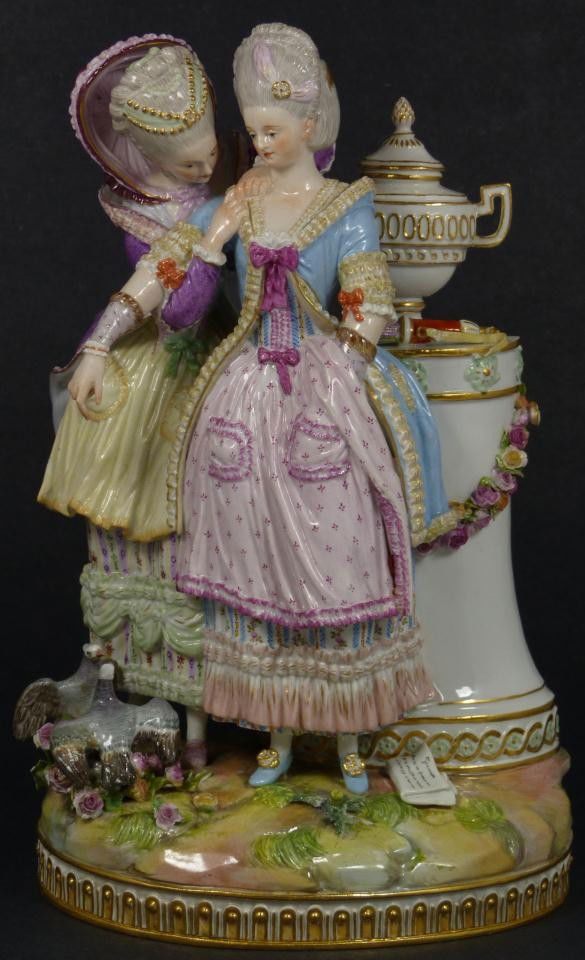MEISSEN PORCELAIN FIGURE OF 2 WOMEN w LETTER: Antique Meissen German porcelain cherub figure. Depicts two women in dresses standing near a column with urn and bow & arrows. Pigeons and flowers can be seen at their feet. One looks upset after read