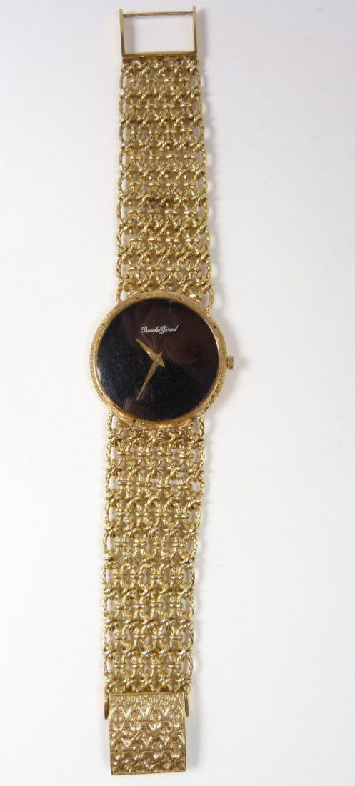 BUECHE-GIROD 18KT Y.G. LADIES DRESS WATCH: Bueche-Girod 18k yellow gold ladies watch. Has black face with with gold dauphine hands. Mesh bracelet with folding adjustable clasp. Marked to clasp. Total weight 39.2dwt / 60.9 grams.