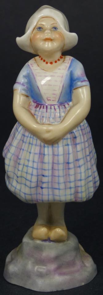 ROYAL WORCESTER FG DOUGHTY FIGURE HOLLAND: Royal Worcester World figure depicting girl with hands folded. Represents the country of Holland. #3074. Measures 5 1/2" height (13.9cm). Guaranteed original. Condition: Great. No apparent chips, crac