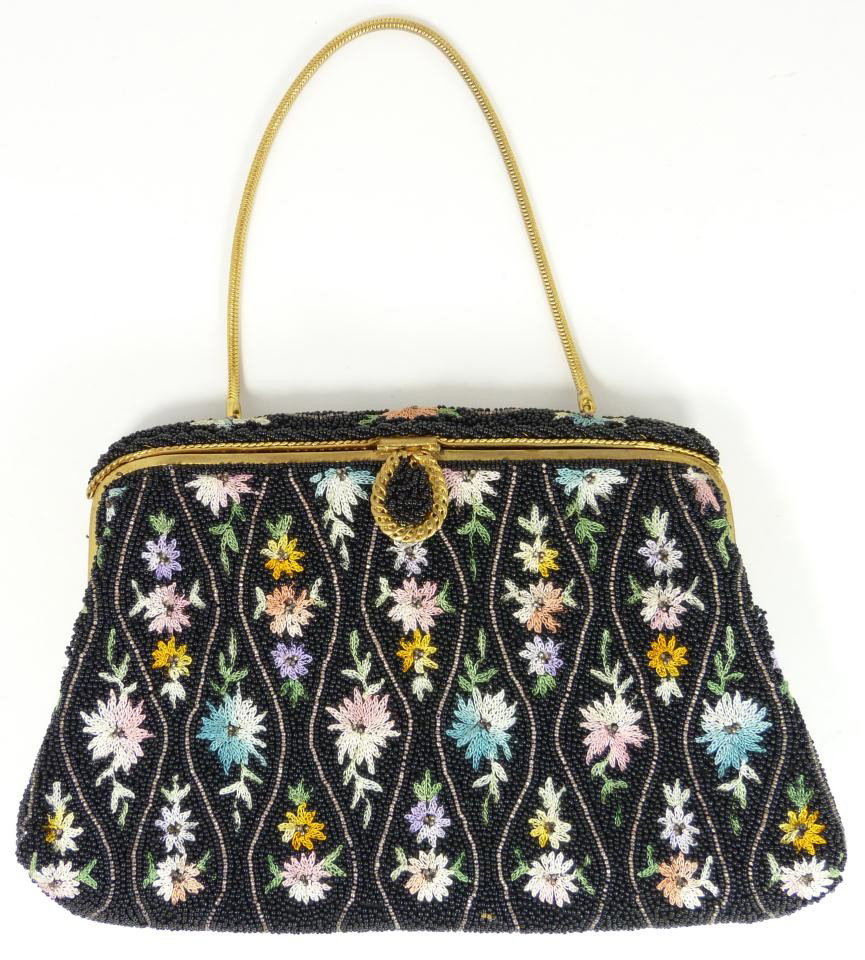 VINTAGE FRENCH BLACK BEADED FLORAL HAND BAG: French micro bead black floral bag. Has hand sewn floral design in diamond matrix pattern. Has gold hardware. Black silk interior with one pocket. Made in France. Measures 5 1/4" height x 8" width (13