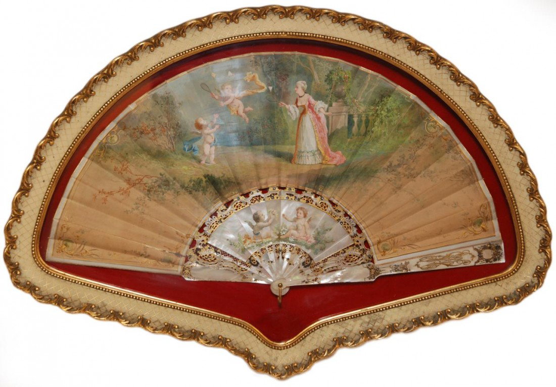 19th C. HAND PAINTED MOTHER OF PEARL FAN IN FRAME: Antique hand painted oil mother of pearl fan depicting a woman playing badminton with cherubs. Has mother of pearl frame with hand painted winged cherubs. Signed C. Legarre. 19th century. Mounted in w