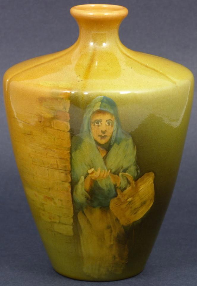 ROOKWOOD GLAZED BRUCE HORSFALL PORTRAIT VASE: Art pottery vase of ovoid form in standard glaze using deep gold tones and high-gloss featuring a full length portrait of a peasant woman, begging with basket over arm and extended hand in classical R