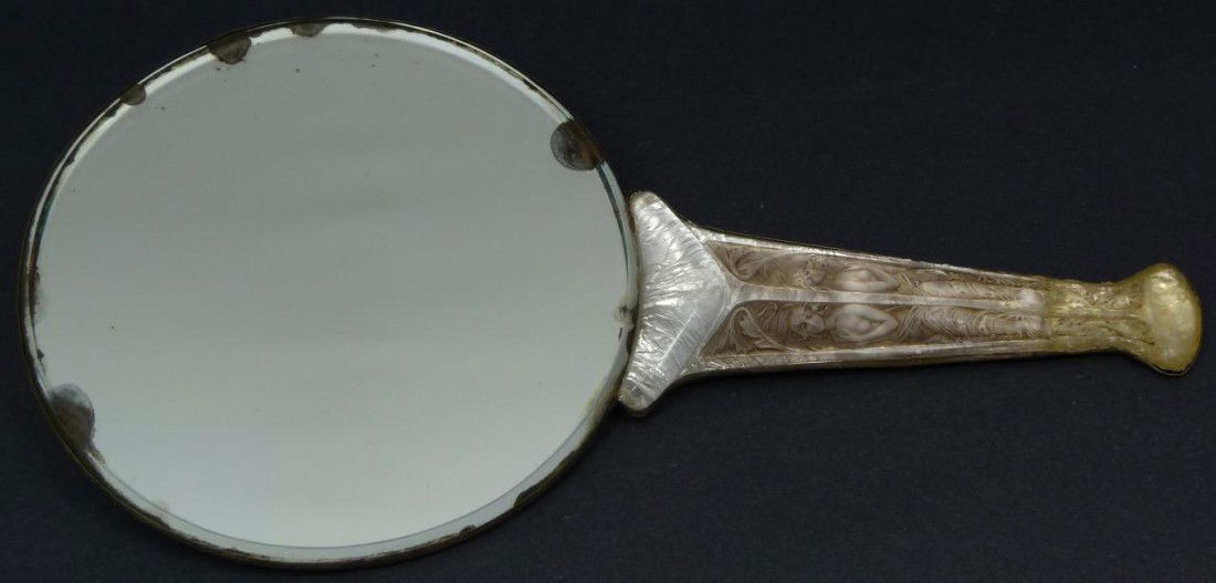 R. LALIQUE FRENCH CRYSTAL 'DEUX FIGURINES' MIRROR: R. Lalique "Deux Figurines" hand mirror. Has clear and frosted design with gray patina. Has original silver on copper backing. Made circa 1912. Measures 12" length x 6 1/4" width (30.4cm x 15.8cm).
