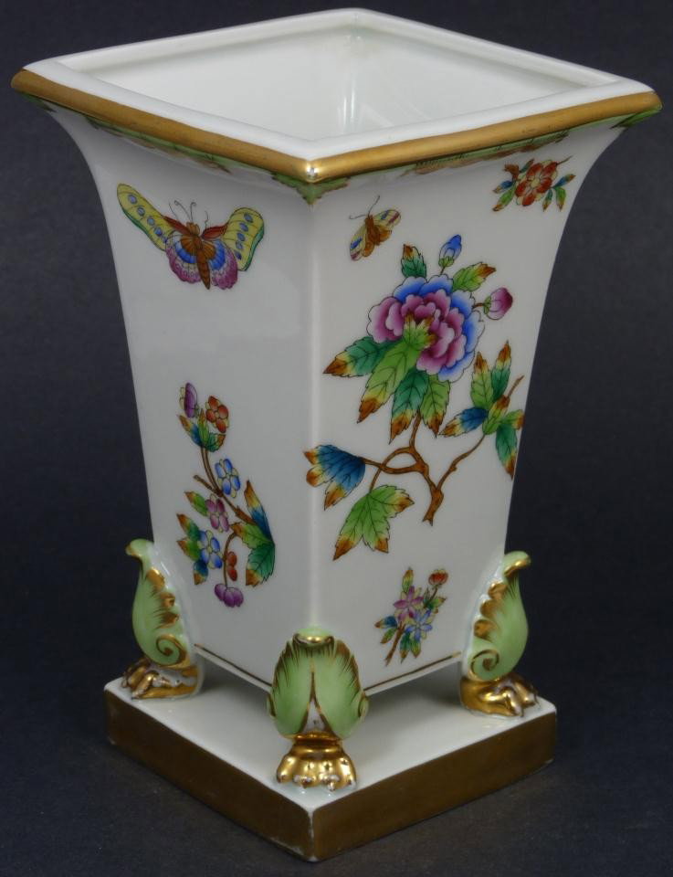 HEREND HUNGARY PORCELAIN FLORAL BUTTERFLIES VASE: Beatiful Hungarian porcealin vase by the Herend company. Has a square shape with scrolled beast feet and hand painted Chinoiserie floral and butterfly design throughout the body. Blue Herend mark to b