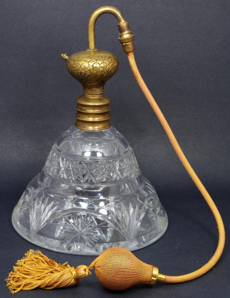 LARGE ANTIQUE CUT GLASS ATOMIZER: Antique cut glass atomizer. Has beautiful star and star burst designs with bands. Has old brass top with scrolled chased design with tubing. 19th century. Measures 11 1/4" height (28.5cm).
