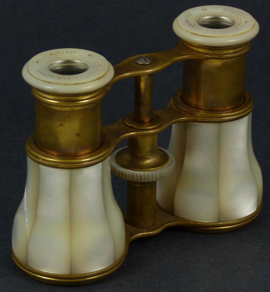 LE MAIRE FRENCH MOTHER OF PEARL OPERA GLASSES: Antique Le Maire French mother of pearl opera glasses. Constructed of brass and clad with mother of pearl. Measures 3" length x 4 1/8" width (7.6cm x 10.4cm).