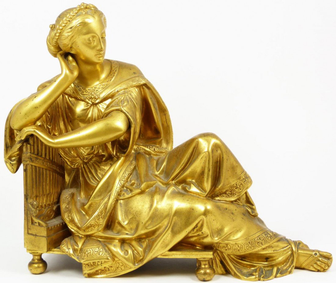 19th CENTURY DORE BRONZE FIGURE OF RECLINING WOMAN: Beautiful antique French gilded bronze depicting a woman reclining on a small organ. 19th century. Measures 10" height x 11 1/2 length x 5 1/2 depth (25.4cm x 29.2cm x 13.9cm)