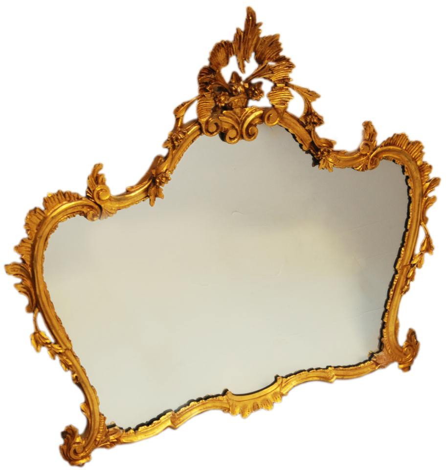 ANTIQUE FRENCH GILDED WOOD CARVED MIRROR: Stunning antique French gilded hand carved wooden mirror. Has a scrolled design throughout with floral design to apex. Measures 36" height x 39 1/2" width (91.4cm x 100.3cm).