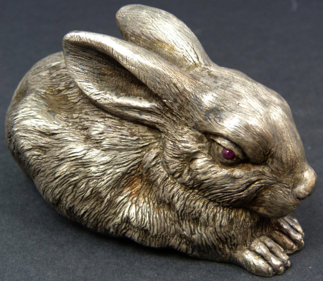 SILVER AND GARNET RUSSIAN HARE FIGURE: Precious Russian silver rabbit figure with eyes of cabochon bezel set garnet stones. Bottom is hallmarked with town marks, Julius Rappaport Cyrillic work master mark, and 84 silver purity marks. Measu