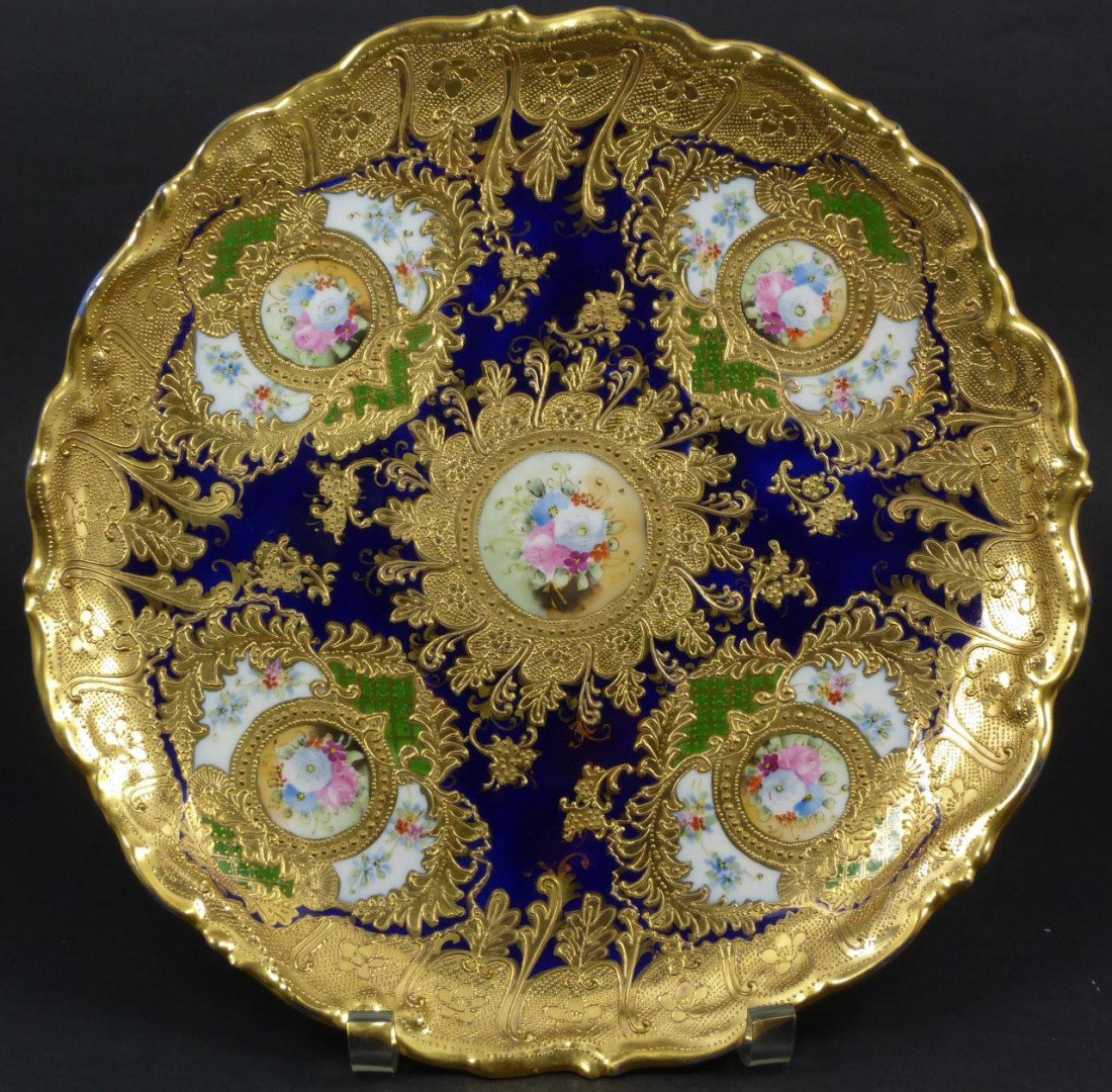 ANTIQUE NIPPON JAPANESE PORCELAIN COBALT CHARGER: Antique Nippon Japanese porcelain hand painted porcelain cobalt charger. Stunning detail throughout with gilded scrolled floral designs bordering 5 floral scenes all over a deep blue cobalt background