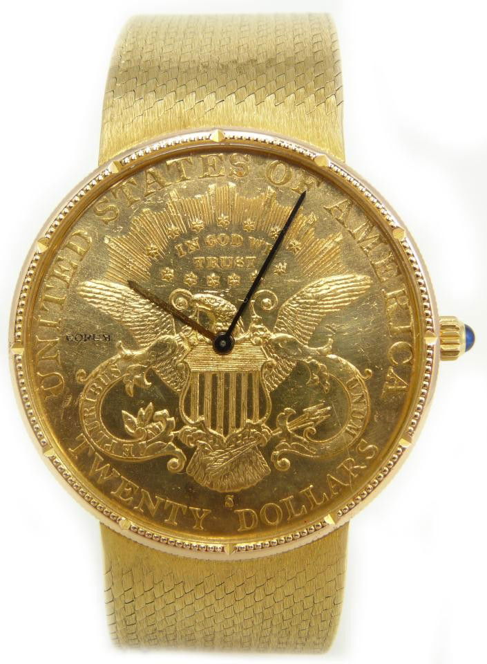 CORUM 18K GOLD GENTS 1897 $20 LIBERTY COIN WATCH: Gents Corum Swiss 18k yellow gold watch. Has a 1897 $20 Liberty San Francisco Mint gold coin design to case. Has domed blue sapphire set to dial. Face has reverse side of coin shown. Has blue metallic