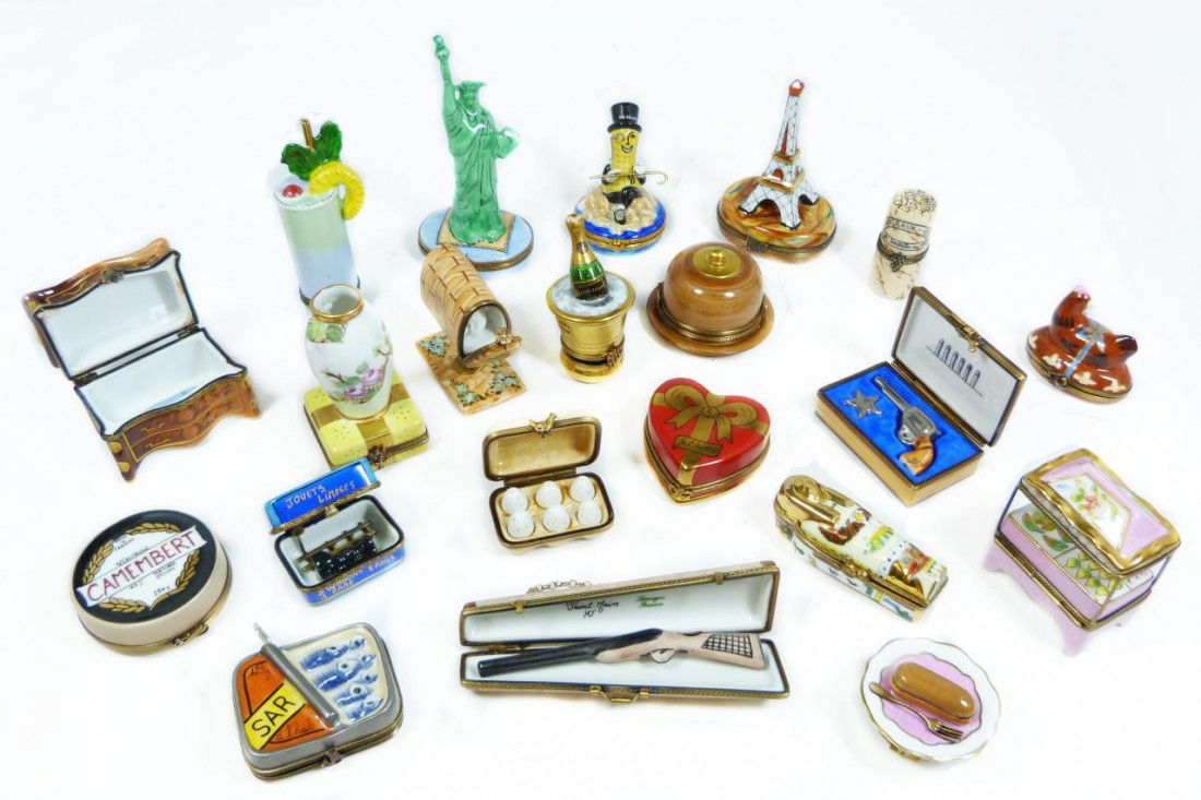 21pc LOT OF HAND PAINTED LIMOGES TRINKET BOXES: 21 piece lot of Peint Main Hand painted Limoges Enamel boxes. Lot includes a plate with pastry and loose fork with spoon latch (Decorators mark S.E.). A sardine box with ship latch. Egg carton box wit