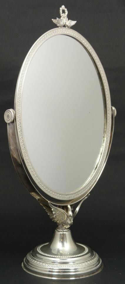 ITALIAN STERLING SILVER SWANS VANITY MIRROR: Oval vanity mirror in silver mounted on a spread winged swan and round base with double swan and wreath pediment. Holds the Italian 5-point star mark and handled vase maker's mark in hexagon. Measures