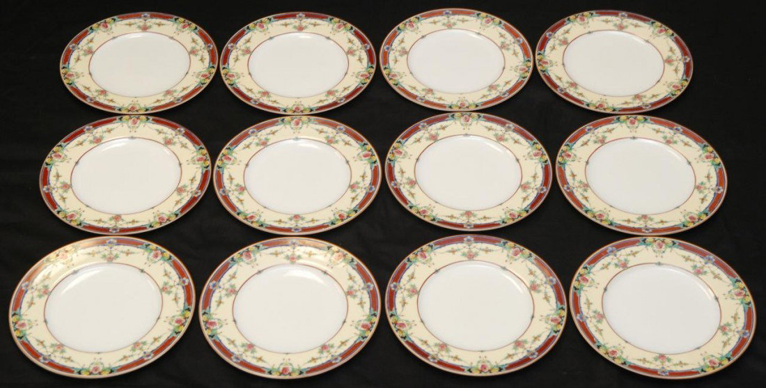 12 ROYAL WORCESTER DAYTONA PORCELAIN DINNER PLATES: Set of 12 Royal Worcester English porcelain hand painted floral dinner plates in the Daytona pattern. Vibrant colors throughout depicting floral designs to border with enamel enhancement over ivory ba
