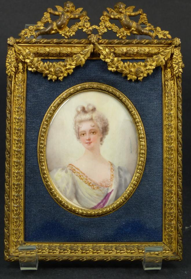 FRENCH HAND PAINTED IVORY PORTRAIT PLAQUE: Antique French hand painted portrait plaque depicting a woman on ivory. Finely painted and signed to mid right hand side of portrait. Mounted in gilded bronze frame with cherubs and floral garlands. 1