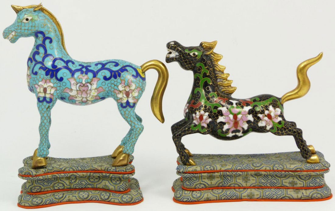 2 CHINESE CLOISONNE ENAMELED HORSES WITH STANDS: 2 Chinese cloisonne enameled gilted metal horses with floral designs throughout. One horse is in a dashing position with the other is standing straight up. Each includes fitted stand. Tallest measures