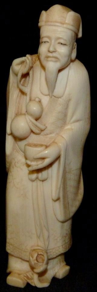 CHINESE IVORY FIGURE OF MAN w DOUBLE GOURD SIGNED: Chinese ivory figure depicting a bearded man with double gourd and cup. Signed to bottom. 19th century. Measures 5" height. Total weight of 125 grams.