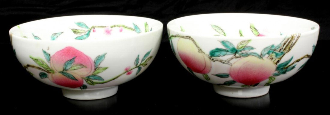 2 CHINESE QIANLONG ENAMELED PORCELAIN PEACHES BOWL: Pair Chinese Qing Dynasty hand painted enameled bowls depicting peaches and bats. Holds Qianlong archaic reign marks to bottom. Each measures 2 1/2" height x 5 3/8" diameter (6.3cm x 13.6cm).
