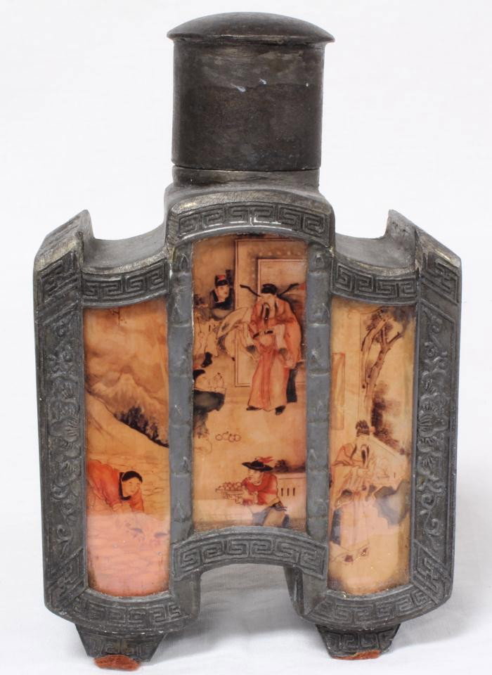 ANTIQUE CHINESE METAL AND PAINTED GLASS FLASK: Antique Chinese metal ware footed flask vessel. Has snuff bottle shape with reverse painted glass panels depicting immortals in palatial courtyard setting to front and back. Has raised floral vase des