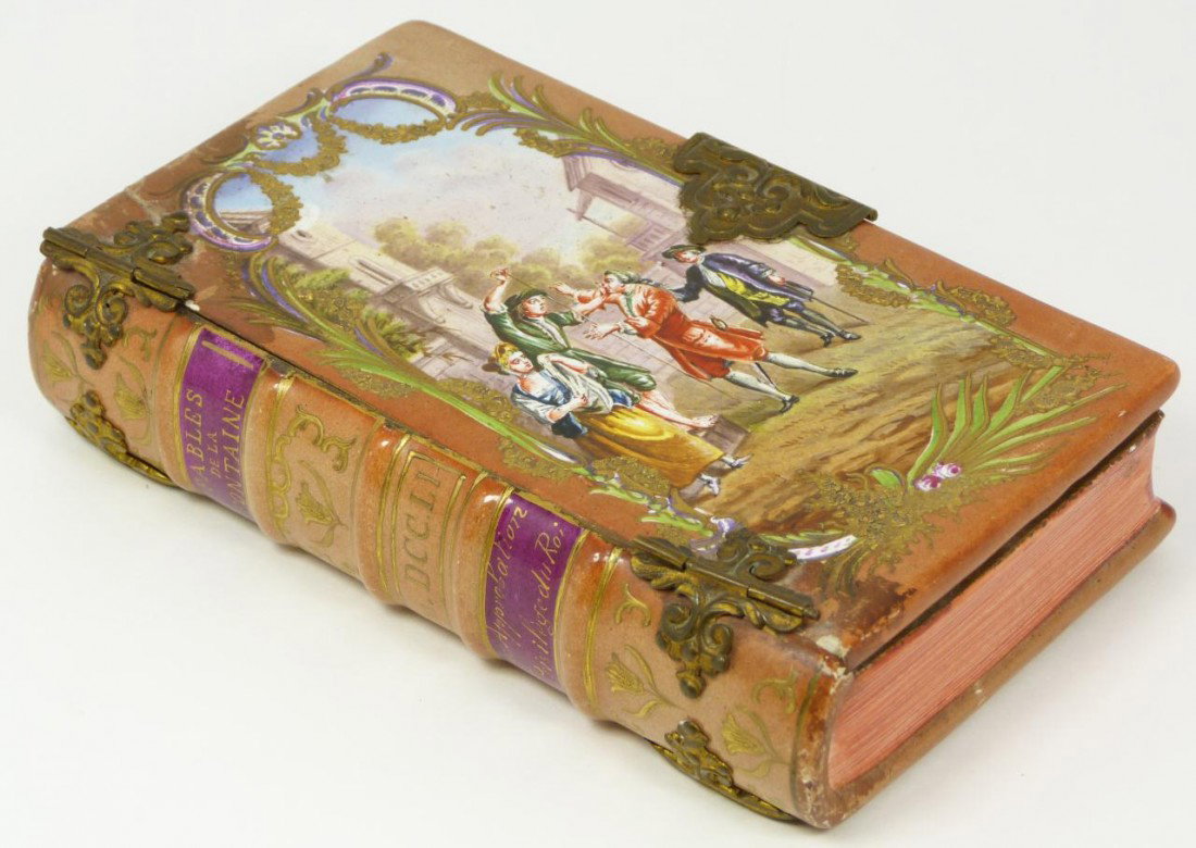 ANTIQUE SEVRES FRENCH PORCELIAN FIGURAL BOOK BOX: Antique Sevres French porcelain figural book hand painted hinged box. Has a stunning enameled and gilded design depicting a fable scene. Has clad bronze hinges and latch. Mid to early 19th century. Me