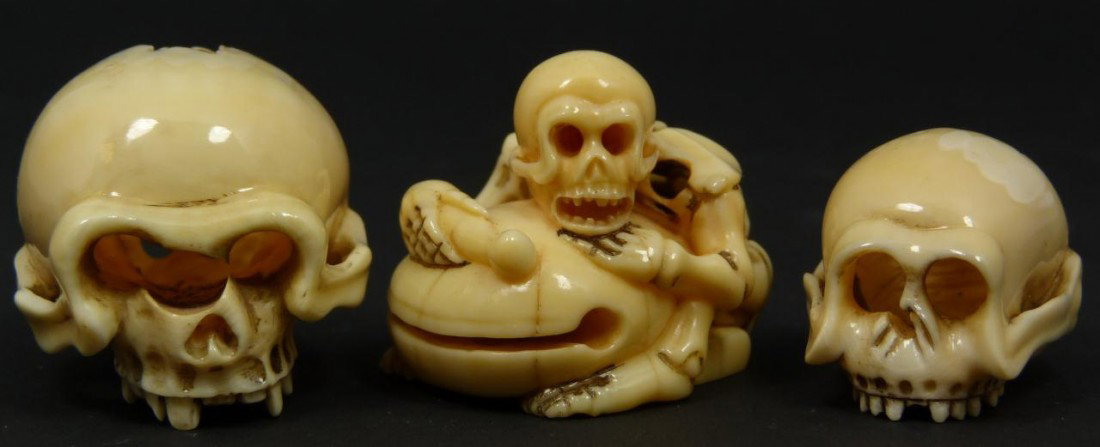 3 JAPANESE CARVED IVORY SKULL NETSUKE FIGURES: 3 Japanese hand carved netsuke skeleton and skull figures. Each finely carved throughout and singed to bottom. Each approx. 2" height (5cm). Total ivory weight of 57 grams.