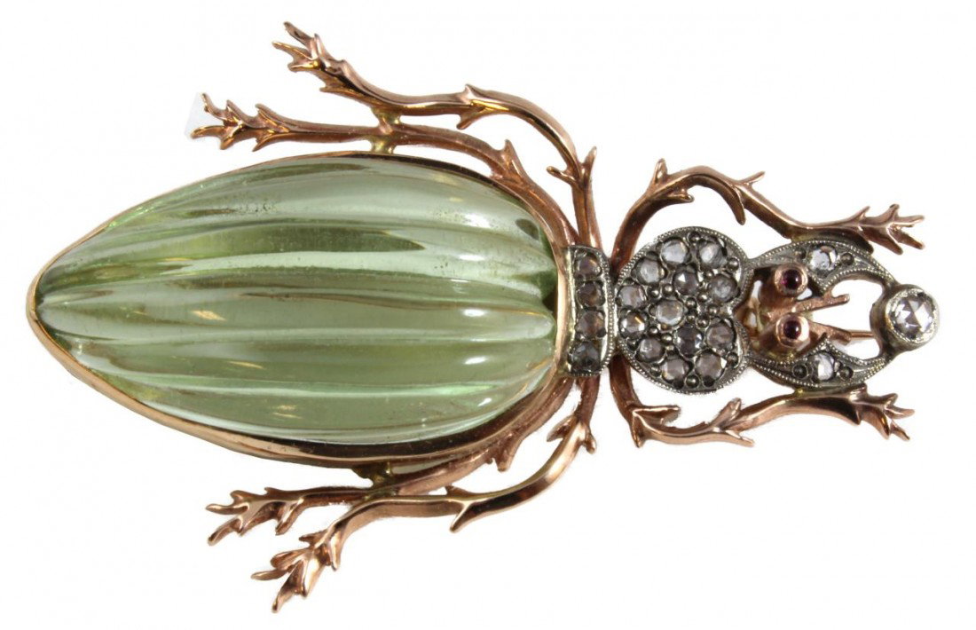 RUSSIAN 14K ROSE GOLD JEWELED STAG BEETLE BROOCH: Stunning 14k rose gold Russian green aquamarine beetle brooch. Has 19 round cut white diamonds approx. .43ctw. Has two cabochon cut ruby eyes. Has large green aquamarine set as abdomen. Holds 56 gold 