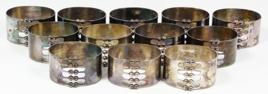 12 MEMA STERLING THERESIA HVORSLEV NAPKIN RINGS: 12 Mema Swedish 925 sterling silver Theresia Hvorslev napkin rings. Each individually hallmarked. Has a reticulated parallel bead design and ovoid shape. Includes 6 original fitted presentation boxes,