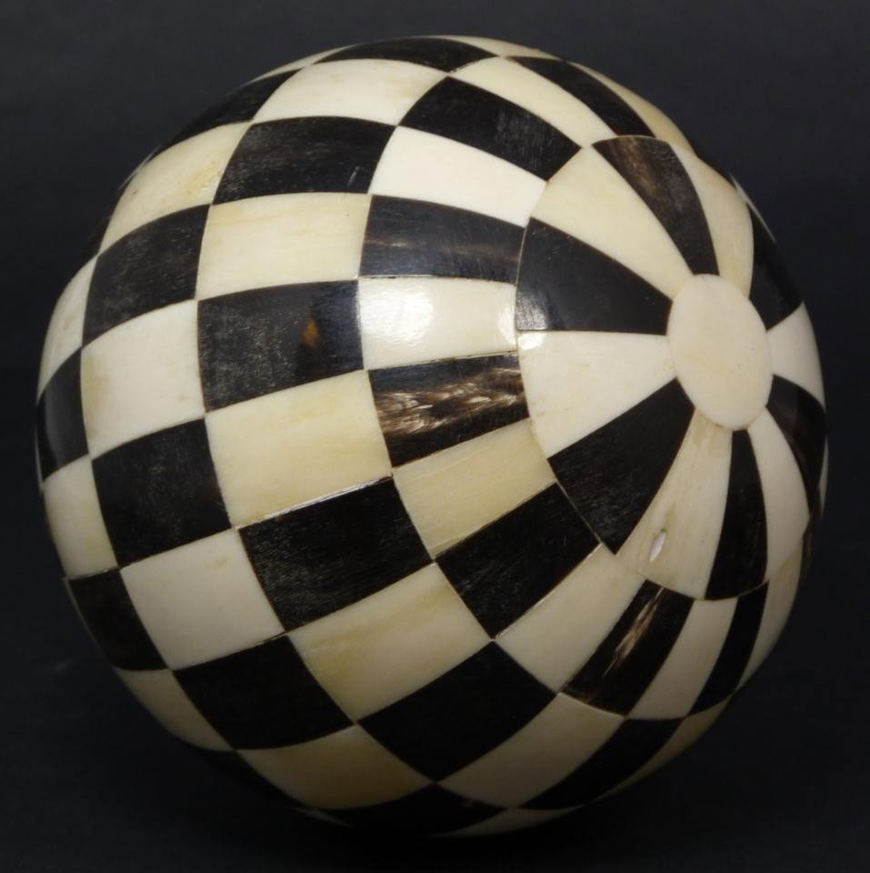 ORIENTAL HAND CARVED OX BONE & HORN BALL: Hand crafted horn and ox bone sphere. Has a alternating checker pattern. Early to mid 20th century. Measures 5" diameter (12.7cm). Total weight of 273 grams.