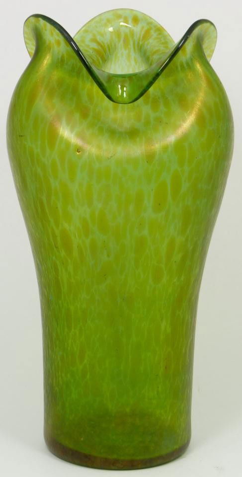 LOETZ CISELE IRIDESCENT PINCHED ART GLASS VASE: Loetz, Austria, 1895-1905. Significant art glass vase, oblong, green with gold iridescent surface indicative of Loetz during the Art Nouveau period of the 1900's. Trumpet form, with pinched and fluted