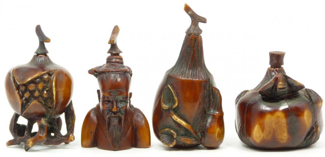 4 CHINESE HAND CARVED IVORY FIGURAL SNUFF BOTTLES: Four Chinese hand carved ivory figural snuff bottles. Lot includes a gourd with roots, bearded sage, pomegranate and pumpkin. Each having a dark brown tea stain. 18th/19th century. Each approx. 2" hei