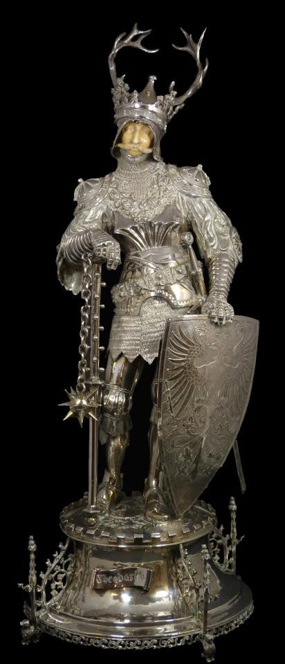 MAGNIFICENT HANAU SILVER & IVORY THEODORICH FIGURE: Absolutely breath taking B. Neresheimer & Sons silver and ivory sculpture Depicting King Theodorich. He is shown in full armor with crowned antlered helmet. His face is constructed of sculptured ivory