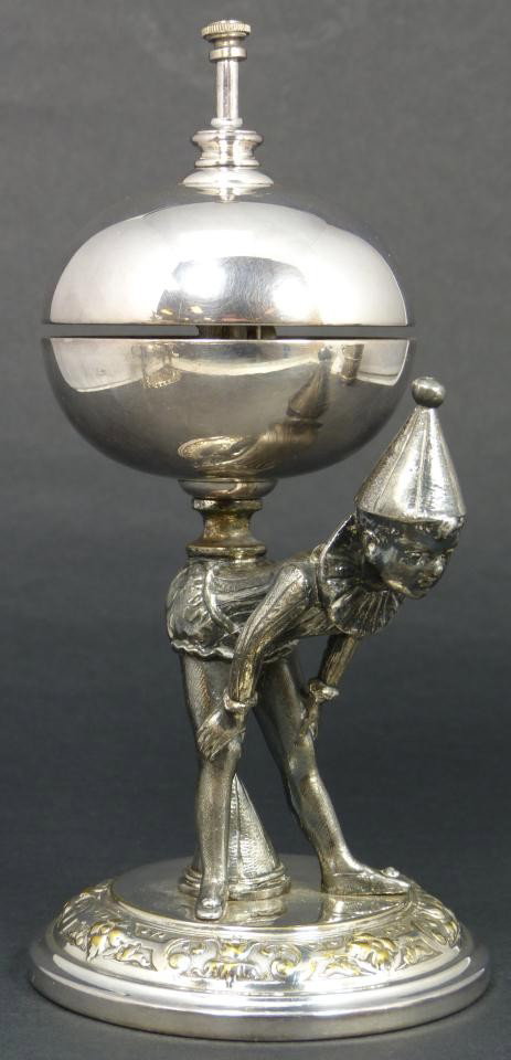 ANTIQUE EUROPEAN SILVERPLATE PIERROT TABLE BELL: Enchanting antique European silver plate figural clown table bell. Depicts pierrot bending over with the bell balancing on it's back. When the button is pushed, his head kicks back to tap the bell. Re