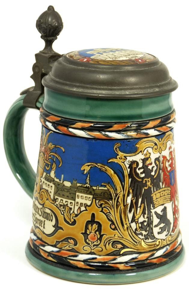 METTLACH STEIN BERLIN PEWTER LID ½ LITER: Mettlach stein of Berlin, 1/2 liter, hinged, pewter lid with Brandenburger Thor panel insert. Fine representation of a traditional Mettlach stein in vibrant multi-colors, marked on bottom with castle,