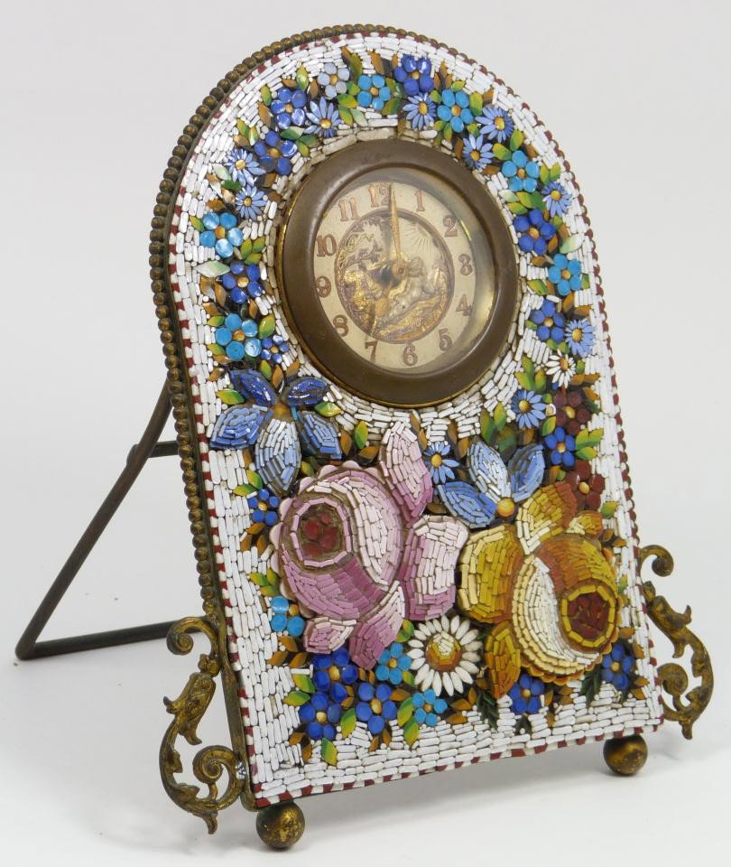 ITALIAN MICRO MOSAIC FLORAL SHELF CLOCK: Italian hand crafted micro mosaic shelf clock having a vivid multicolor stone raised floral design. Has white enamel face with gold Arabic numerals. Has gold and silvered design to center depicting ch