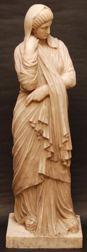 ITALIAN CARVED ALABASTER FIGURE OF WOMAN: Antique Italian hand carved alabaster figure depicting a Roman female in layered robe. 19th century. Measures 27 5/8" height (70.1cm). Approx. weight of 68.5 pounds.