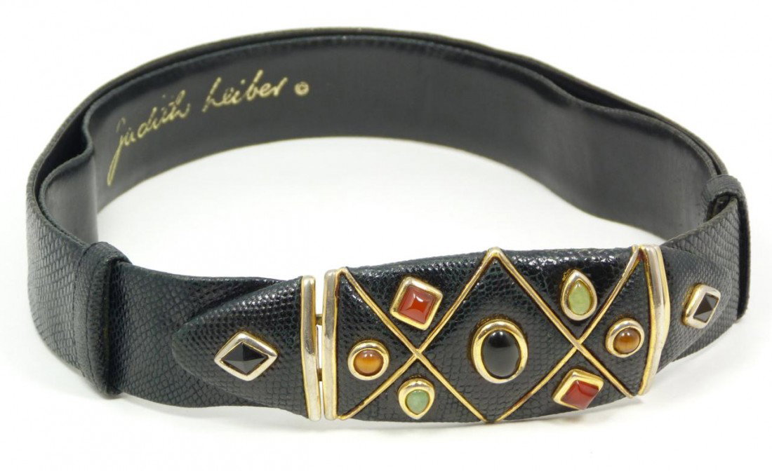 JUDITH LEIBER LADIES BLACK LIZARD JEWELED BELT: Black, lizard skin belt by designer Judith Leiber, buckle highlighted in gem stones of jadeite, tiger eye, cinnabar and black onyx. Size: adjustable straps slide between 24"- 38" (61.5cm x 96.54cm).