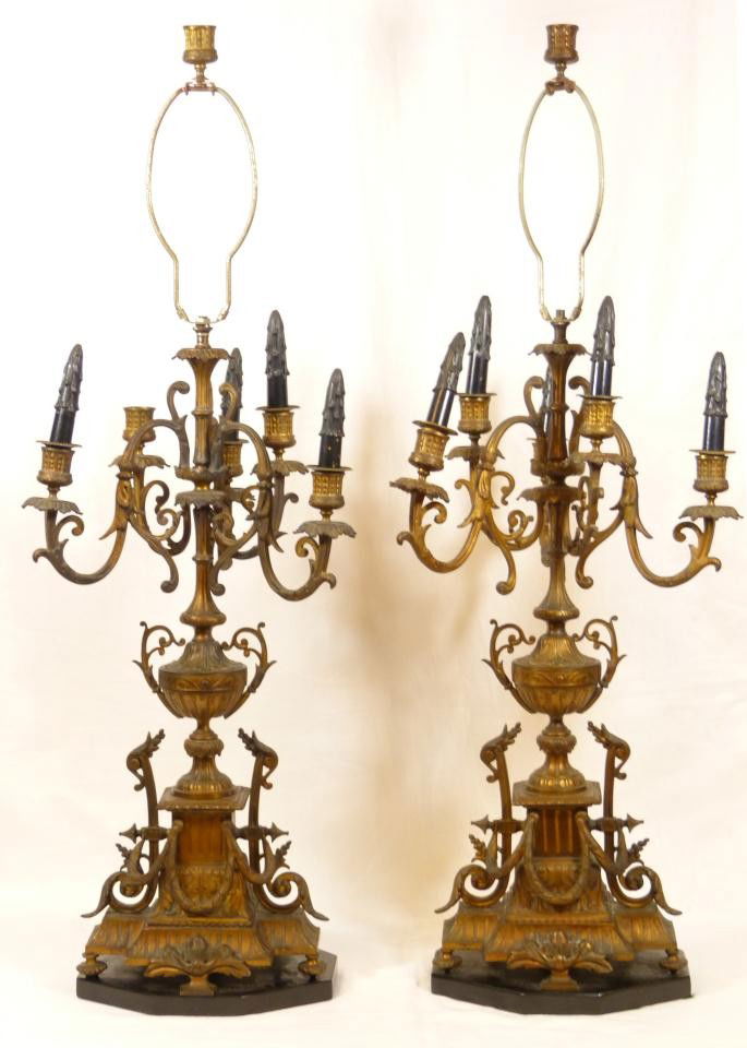 Pr ANTIQUE BRONZE 6 ARM CANDELABRA LAMPS: Pair of antique bronze 6 arm candelabra table lamps having a scroll and leaf and garland design throughout. Each mounted on octagonal black marble base. 19th century. Each measures approx. 38" height