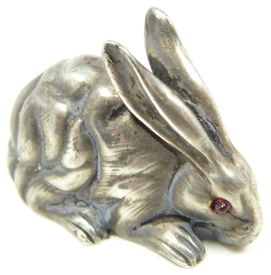 IMPERIAL RUSSIAN SILVER RABBIT FIGURE: Russian silver rabbit figure having cabochon cut ruby jewels set to eyes. Has town marks and 84 silver purity marks to bottom. Also hold Julius Rappaport workmaster cyrillic I.P. marks to bottom. Meas