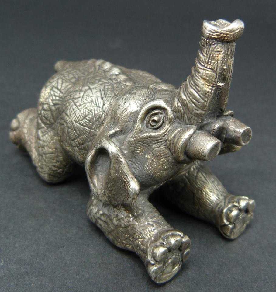 IMPERIAL RUSSIAN SILVER ELEPHANT FIGURE: Imperial Russian silver elephant doing hand stand. Holds town marks and 84 silver purity marks to bottom of trunk. Measures 2 5/8" height x 2 1/4" width (6.6cm x 5.7cm). Total weight of 6.5ozt/203 gra