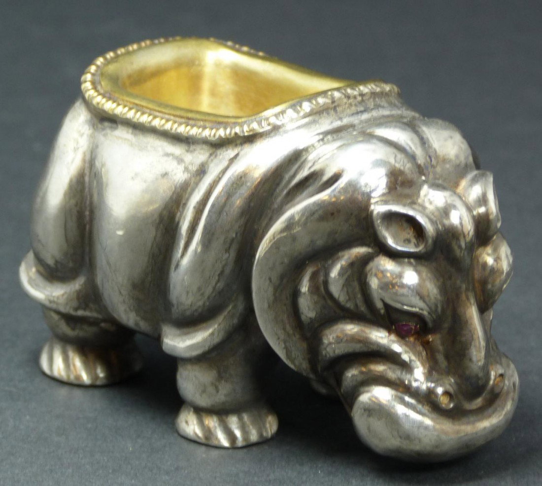 IMPERIAL RUSSIAN SILVER FIGURAL HIPPO SALT CELLAR: Imperial Russian silver standing figural hippopatamus salt cellar having cabochon cut ruby jewels set to eyes and gold wash to bowl. Bowl has stylized laurel leaf border design. Holds town marks and 8