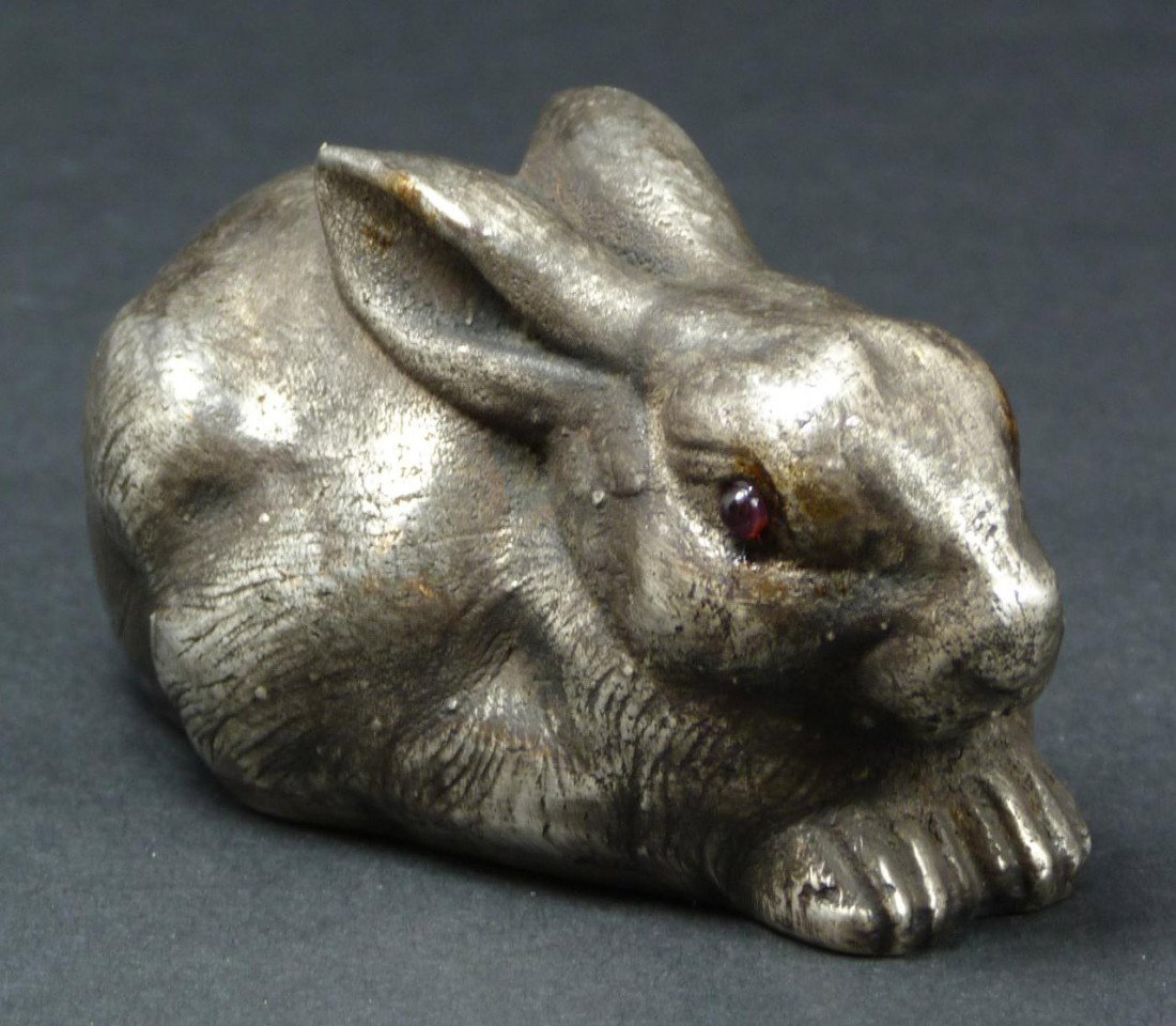 IMPERIAL RUSSIAN SILVER RABBIT FIGURE: Russian silver rabbit figure having cabochon cut pink sapphire jewels set to eyes. Has town marks and 88 silver purity marks to bottom. Also hold Julius Rappaport workmaster marks to bottom. Measures 